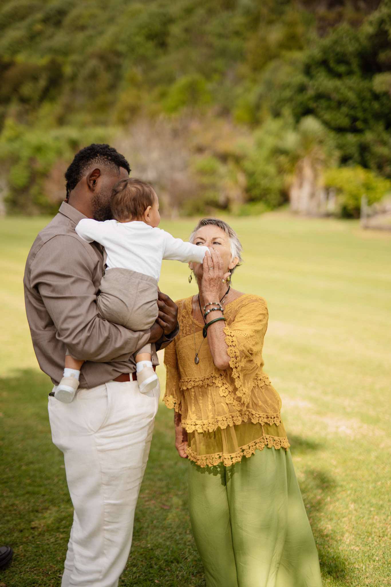Linda Deverell with newlyweds Chloe and Brandon at their Waiheke Island ceremony