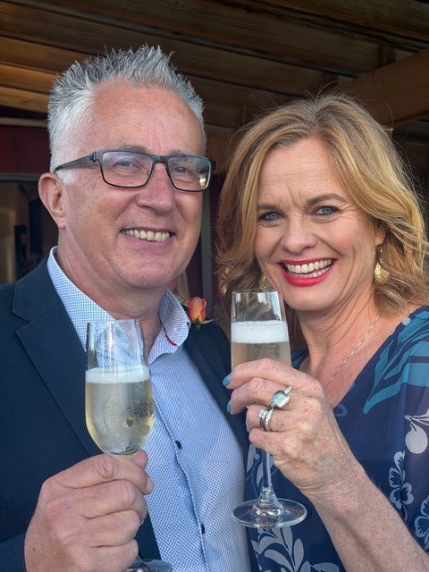 Lucy and Carlos celebrating with champagne at their Waiheke Island wedding
