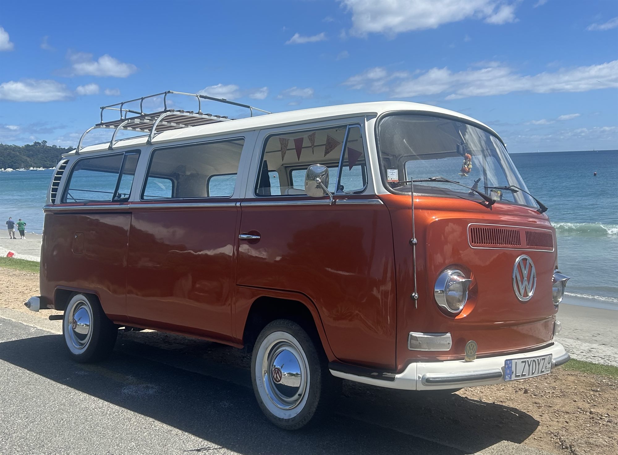 Solana the 1969 Kombi van parked on the beach at Waiheke Island - iconic wedding transport