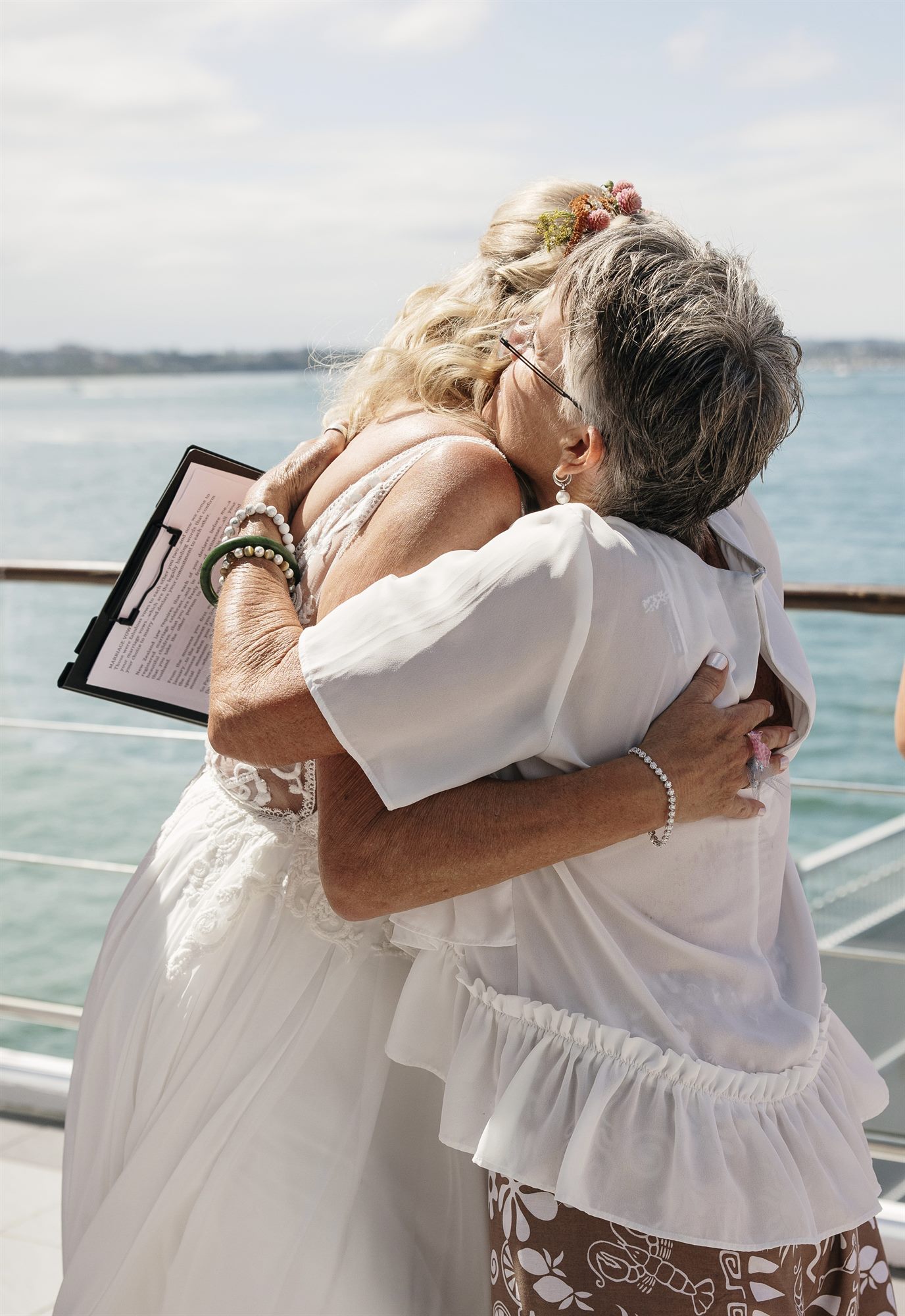Linda sharing a heartfelt hug with Sue after their Waiheke Island wedding ceremony