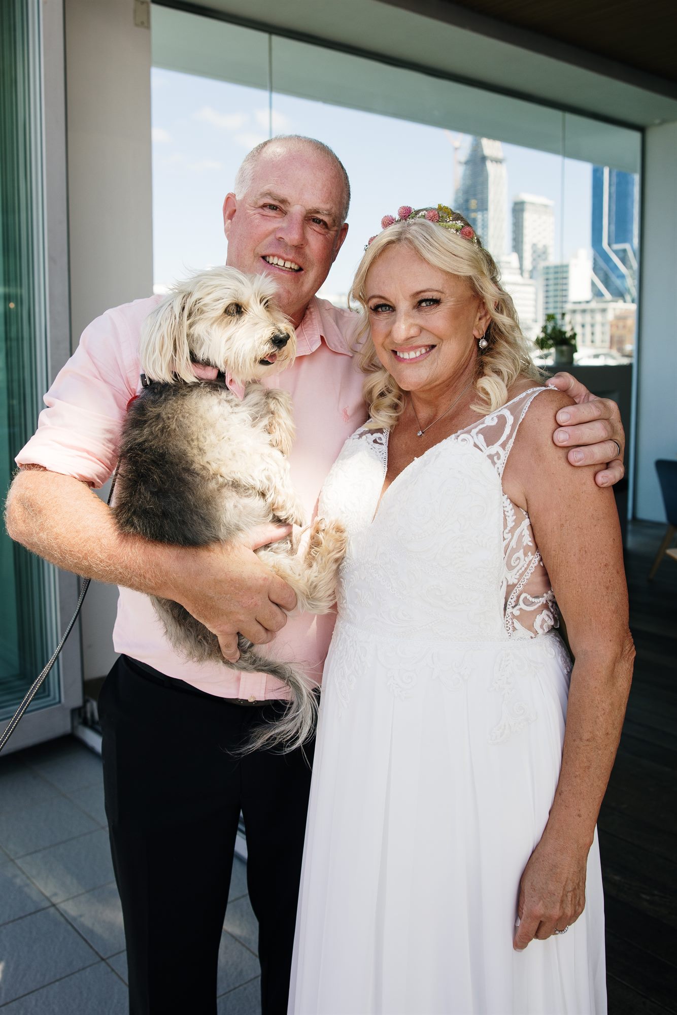 Sue and Pablo with their dog on their wedding day on Waiheke Island